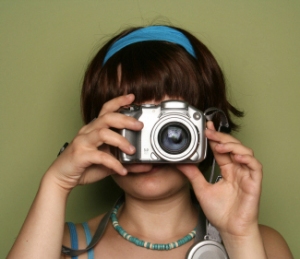 young woman behind camera cropped